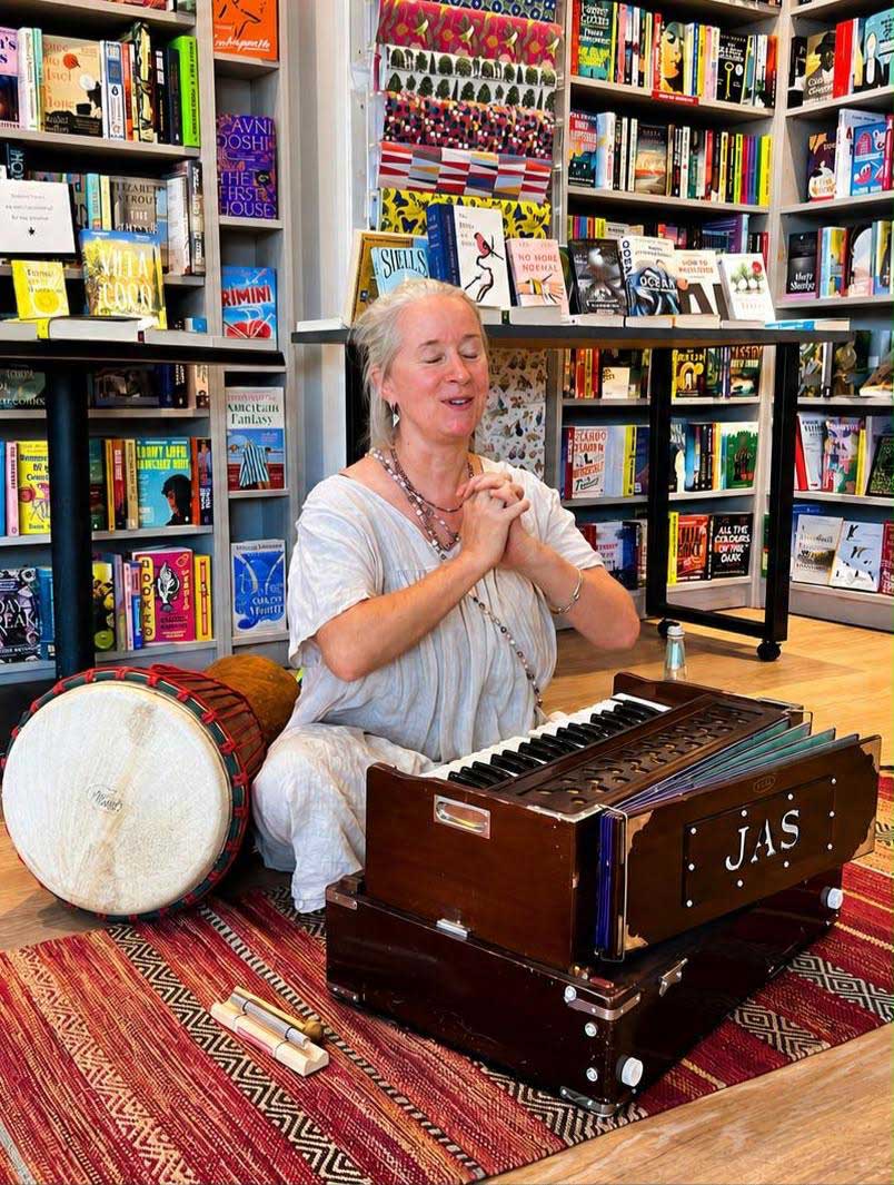 Alys Hennessy playing harmonium at Parade's End Bookshop